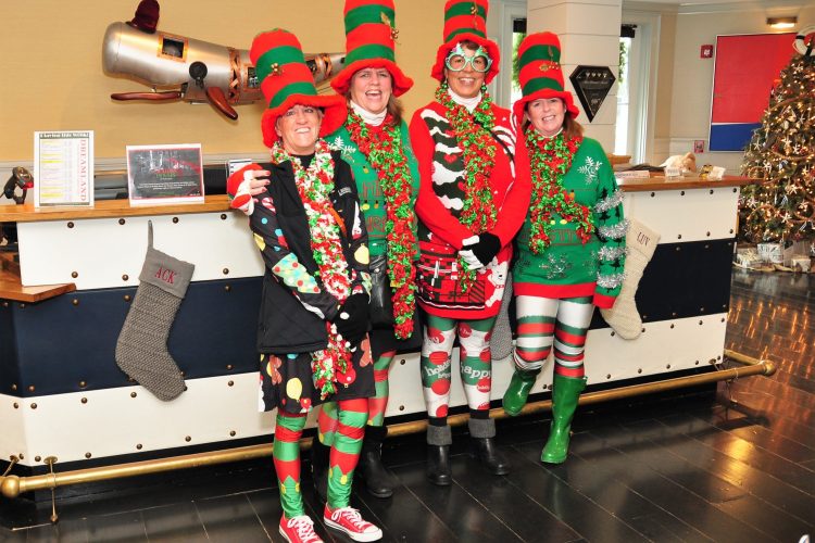4 people dressed up as elves