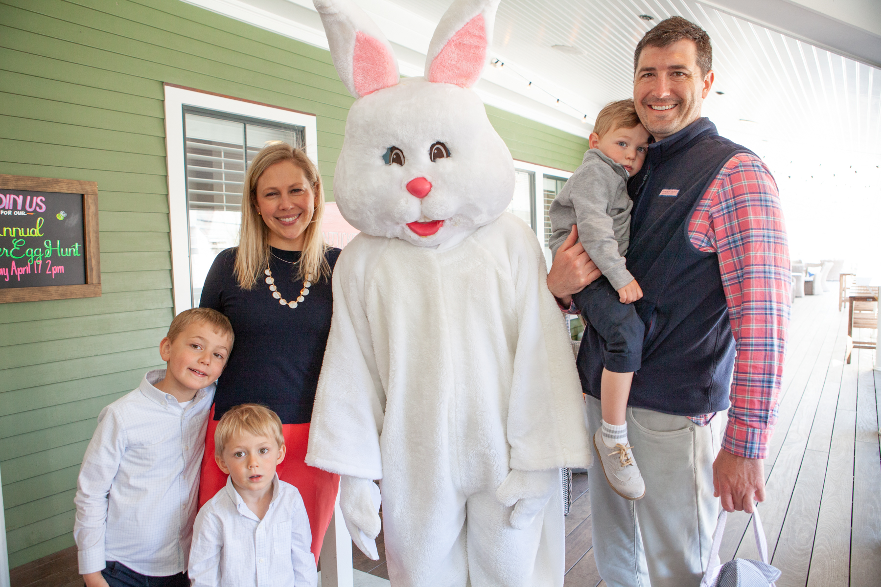 A family stands with the Easter Bunny