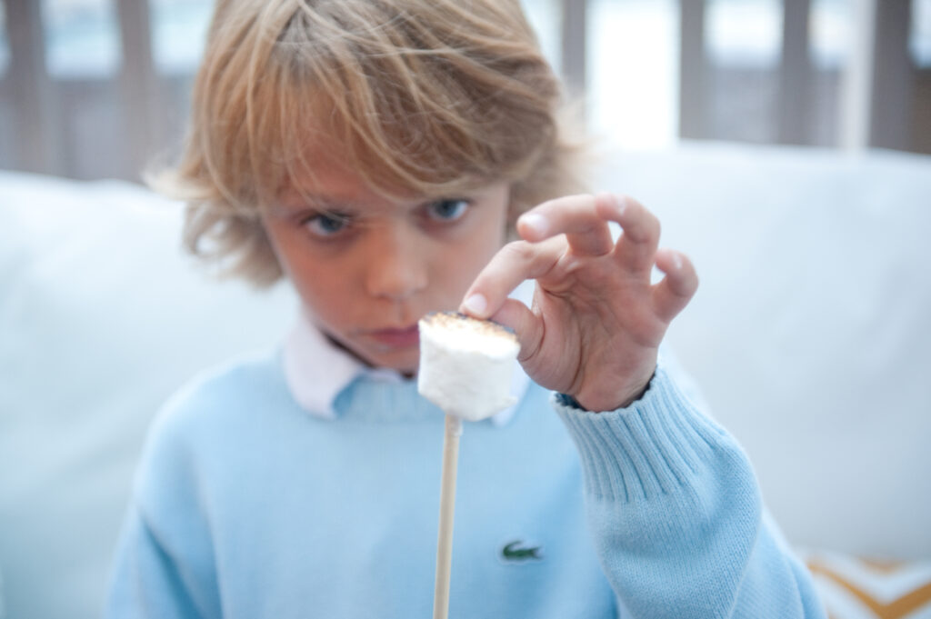 A child with a marshmallow