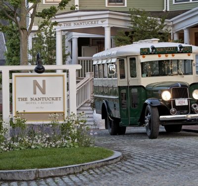 The Nantucket Hotel with a vintage bus in front of it