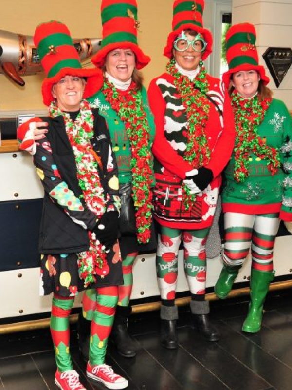 4 people dressed up as elves